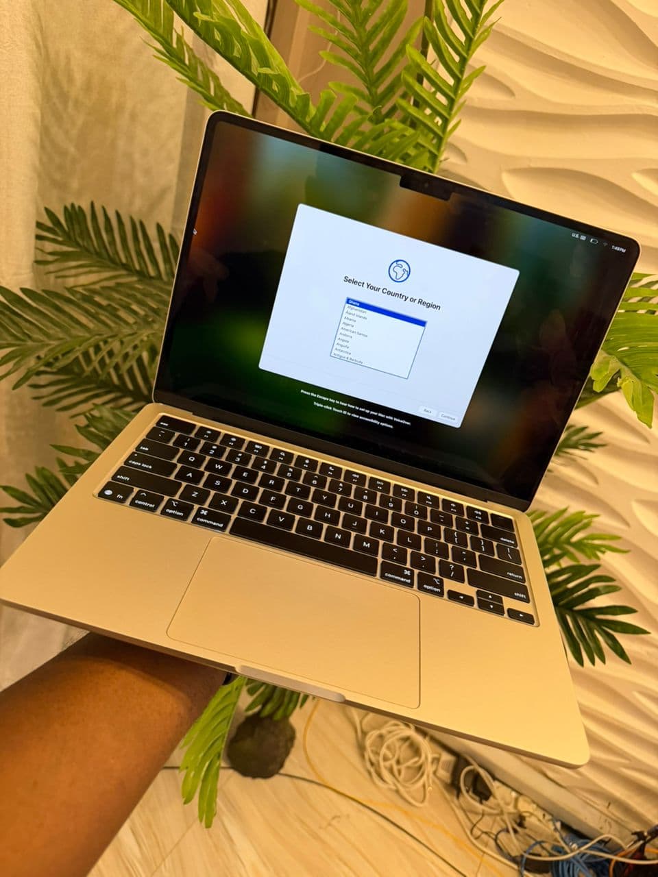 MacBook Air in gold during setup